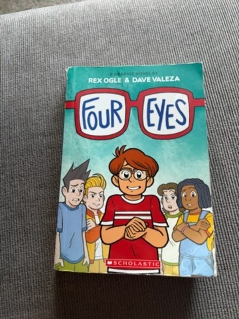 Four Eyes Graphic Novel by Rex Ogle & Dave Valeza - Teal Cover with Red Accents